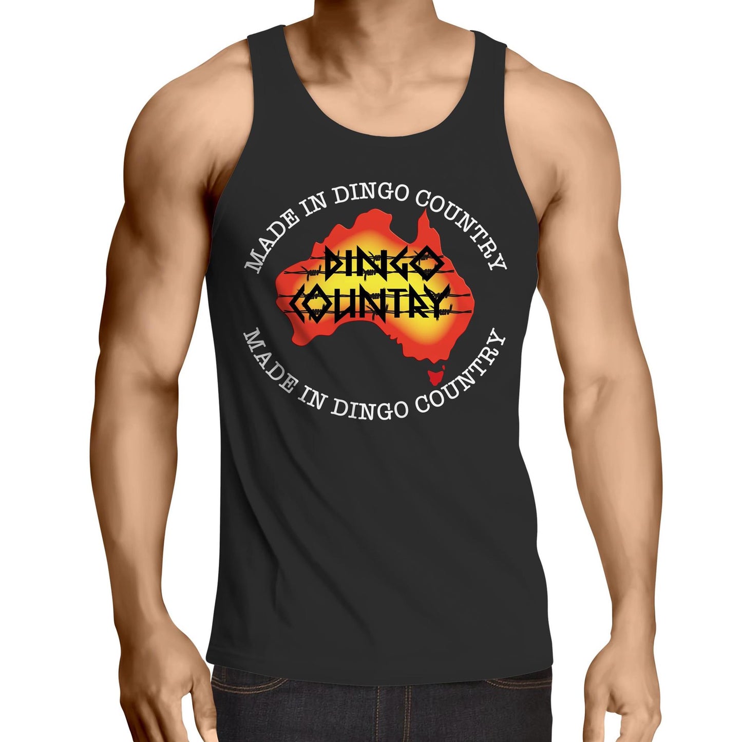 Man wearing a 'Made in DC Australia' men's black singlet featuring a bold map of Australia with 'Dingo Country' text, Made in Australia text surrounds the image- symbolising Australian pride.