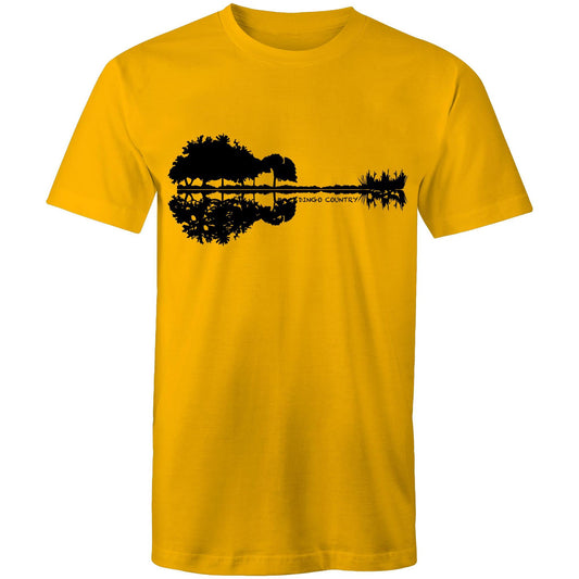 Gold T-shirt showcasing a creative black graphic that merges a reflection of trees and rocks to form a guitar silhouette, with 'DINGO COUNTRY' printed below. Music inspired.